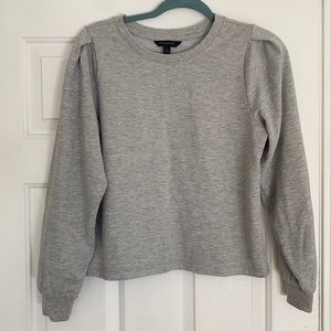 gray sweatshirt with poofy sleeves
